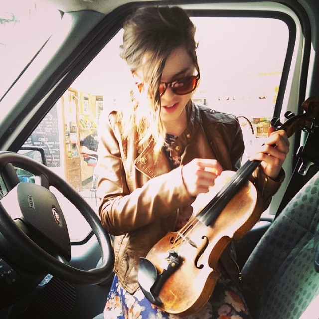 Laura listening to @brittfiddle in the driver's seat in Brighton. - from Instagram
